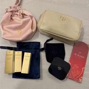 Clé de Peau toner and Cosmetic Bags
